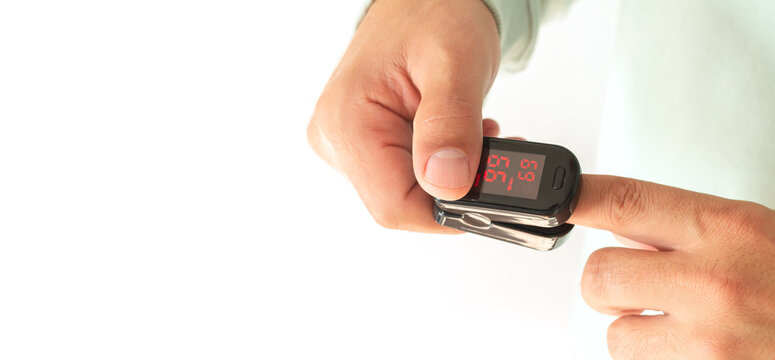 Banner patient holding electronic oximeter or oxymeter - Powered by Adobe