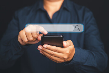 Search engine online concept. Close-up of hand a man in blue shirt using smartphone search for information interest on search engine web site. Technology and internet network concept