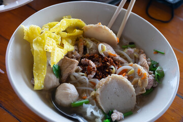 Asian noodles in Thailand in a white tiled bowl