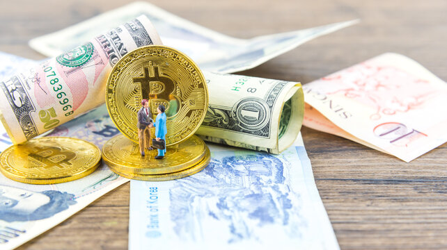 bitcoin the most important and various foreign currencies. cryptocurrency concept. Business shaking hands of partner over the  bitcoin and global and money background.