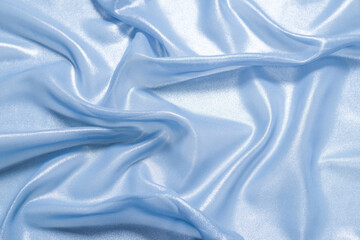 Blue shiny pearl fabric as a background.