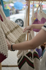 Series photo of young women choosing new shopping bag in street market , refreshing look concept