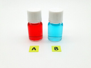 Which treatment, medicine or vaccine would you choose? Two vials with red and blue liquid in them with the letters a and b in front of them.