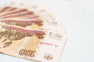 business, finance, saving, banking and people concept - close up bundle of money Russian Banknotes one hundred rubles