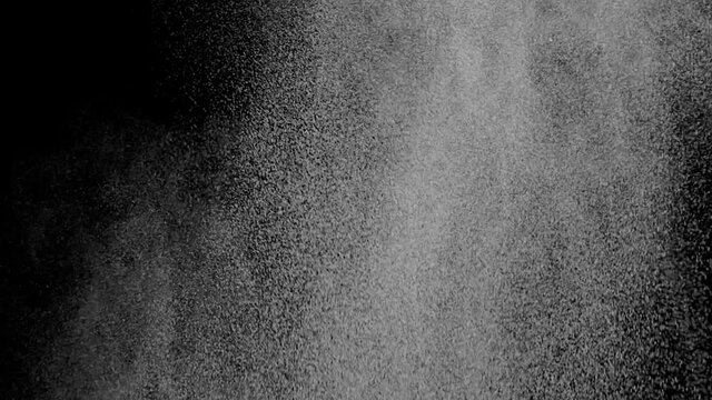 Amazing refreshing drops flow flies on black background
