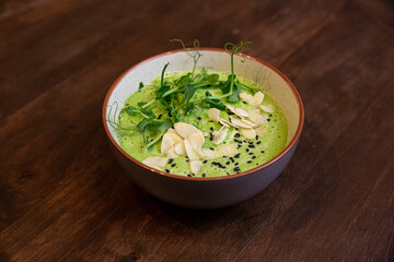 detox soup in bowls on rustic wooden board, Clean eating, dieting, vegan, vegetarian, healthy food concept