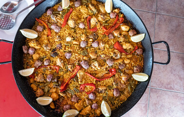 Paella, a dish based on rice, meat and vegetables, cooked in a paella pan, typical of Valencia (Spain)