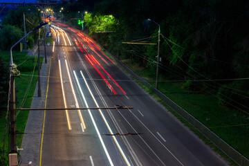 Car light trails on a city street at night