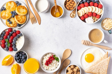 The continental breakfast is captured from above, top view. Coffee, croissants, granola, Belgian waffles, honey, jam. Layout with free text space, copy space