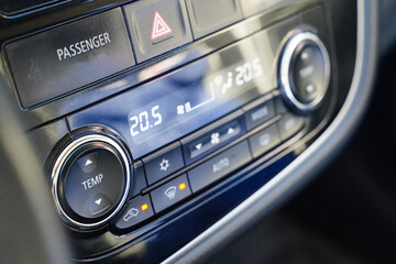 Temperature button and climate control in a car.