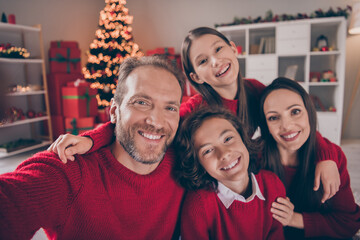 Photo of good relationship family hug do selfie wear red sweaters x-mas holiday tree indoors house