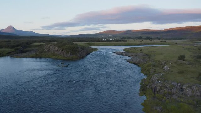 Fly by over a river at sunset