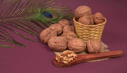closeup photo of a walnut seed in wooden bowl. Food that is good for brain and lower risk of heart disease.