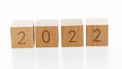 Four building blocks with number 2022 on white background