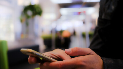 woman hands with phone at the airport. chat, video call, social.