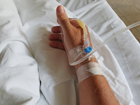Peripheral venous catheter in the vein of human hand