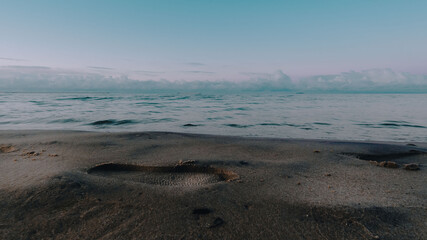 shoe print on a sandy beach