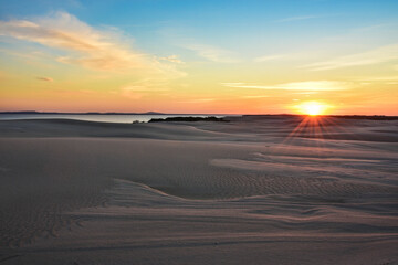 Obraz na płótnie Canvas moving dunes in Leba, Poland, beautiful sunset