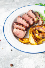 duck breast side dish second course fresh ready to eat meal snack on the table copy space food background rustic. top view keto or paleo diet