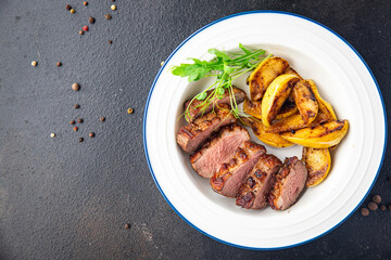 duck breast side dish second course fresh ready to eat meal snack on the table copy space food background rustic. top view keto or paleo diet