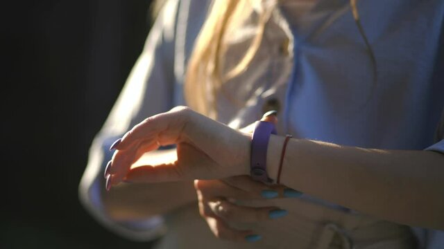 Close Up Of Girl Looking At Smart Watch