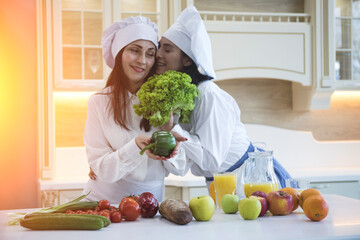 Two cheerful friends cook together. Friends Chef Cook Cooking Concept.
