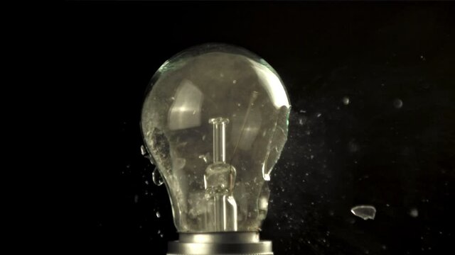 Super slow motion glass bulb bursts. On a black background. Filmed on a high-speed camera at 1000 fps.High quality FullHD footage