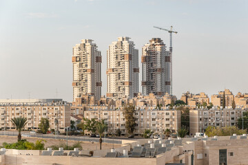 Contrast in buildings 4 generations Architecture in Israel, modern tower skyscrapers and aged old buildings in Beer Sheba, Israel Old and new development architecture concept.
