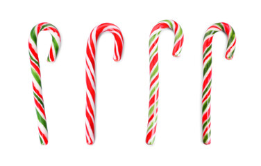 Set with yummy sweet Christmas candy canes on white background