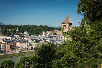 View of Salzburg, the river Salzach and the mountains from the old Kapuzinerberg wall on a sunny summer day, Austria
