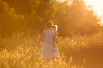 summer sunset mom and daughter walking