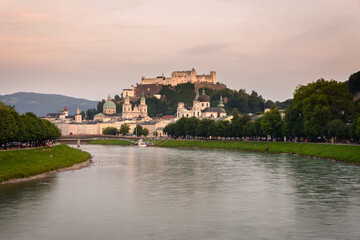 Fototapeta na wymiar Panoramic view of Salzburg skyline with river Salzach in summertime at sunset, Austria