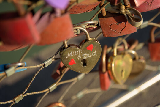 Love padlocks mum and dad hanging from fence