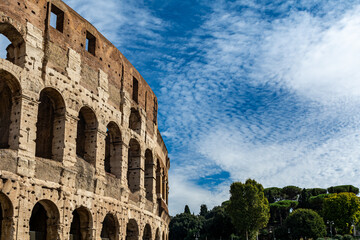 Obraz premium Detail of the Colosseum (Coliseum) in Rome, Italy. It is the main tourist attraction of Rome. Ancient Roman architecture and ruins of Rome in sunlight. 