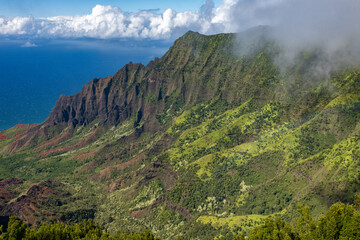 View of Kalalau Valley with several green ridges and the ocean in kauai, hawaii.