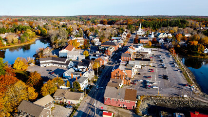 Aerial view of small coastal new england maine town - main street with white church