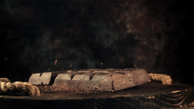 Super slow motion dark chocolate bar drop. Filmed on a high-speed camera at 1000 fps. High quality FullHD footage