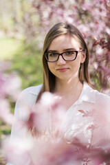 spring portrait of a girl with glasses in the park © ms16_photo