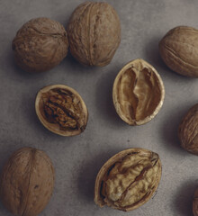 Dark wallpaper with brown nuts on old table