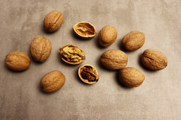 Tasty walnuts on brown table