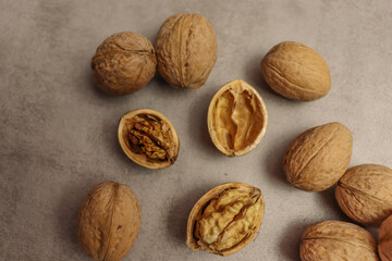 Beautiful food background with brown nuts on old table