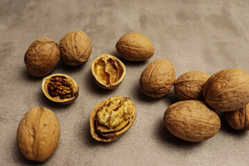 Beautiful food background with walnuts on brown table