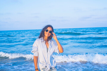 Young indian woman happy in the beach