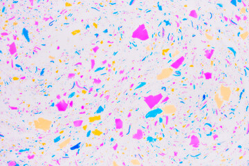 Colorful terrazzo texture. Multicolored spots and inclusions on a white, abstract background.