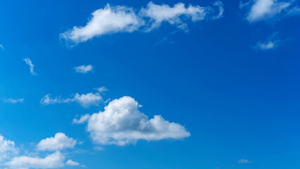 beautiful cumulus clouds against the blue sky as a natural background