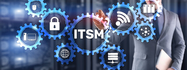 ITSM. Businessman pressing virtual screen IT Service Management. Concept for information technology...