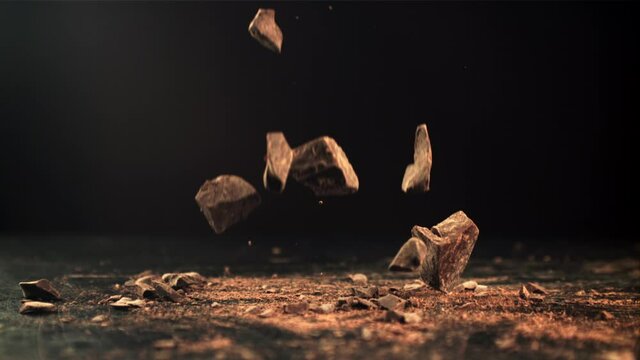 Super slow motion a drop of crushed dark chocolate. Filmed on a high-speed camera at 1000 fps. High quality FullHD footage