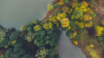 Aerial view of two lake and autumn forests on morning. Place for fishing