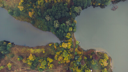 Aerial view of two lake and autumn forests on morning. Place for fishing