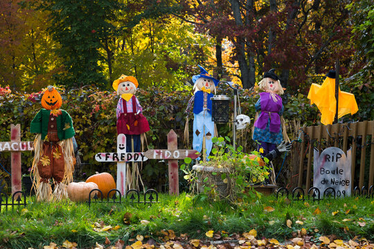 Cute Halloween display with colourful characters and make-believe tombs and crosses seen during a beautiful fall afternoon